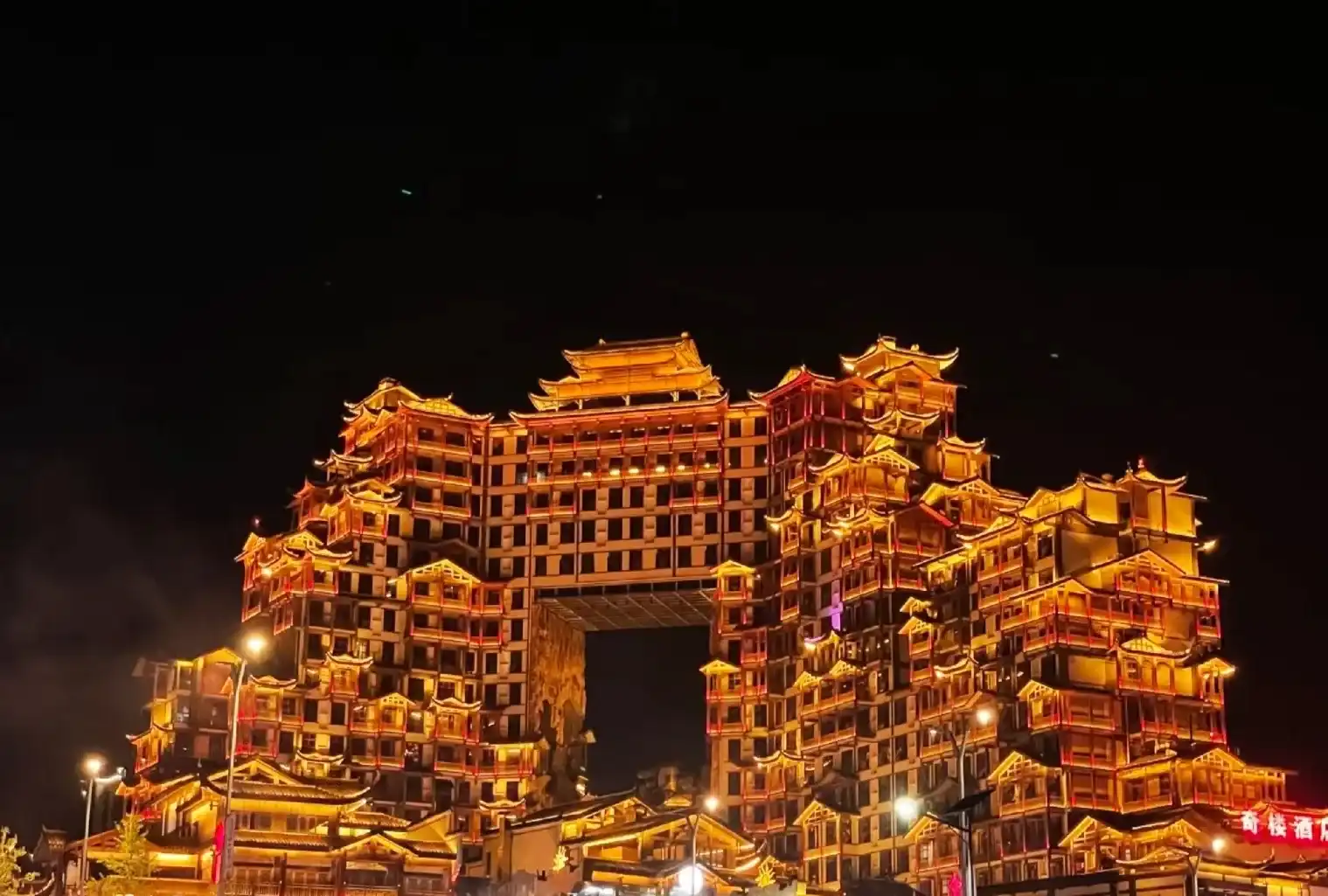 The illuminated Seventy-two Wonder Tower with its central open volume