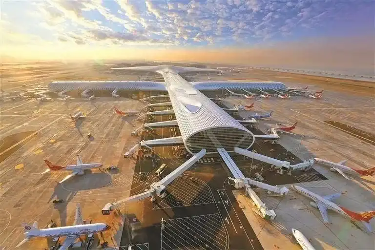 Aerial view of Terminal 3 and the apron at Shenzhen Bao'an International Airport at sunset