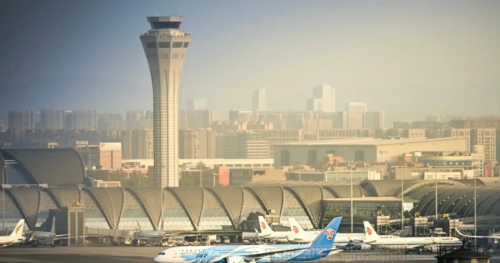 Terminal area, apron, aircraft, and control tower at Chengdu Shuangliu International Airport