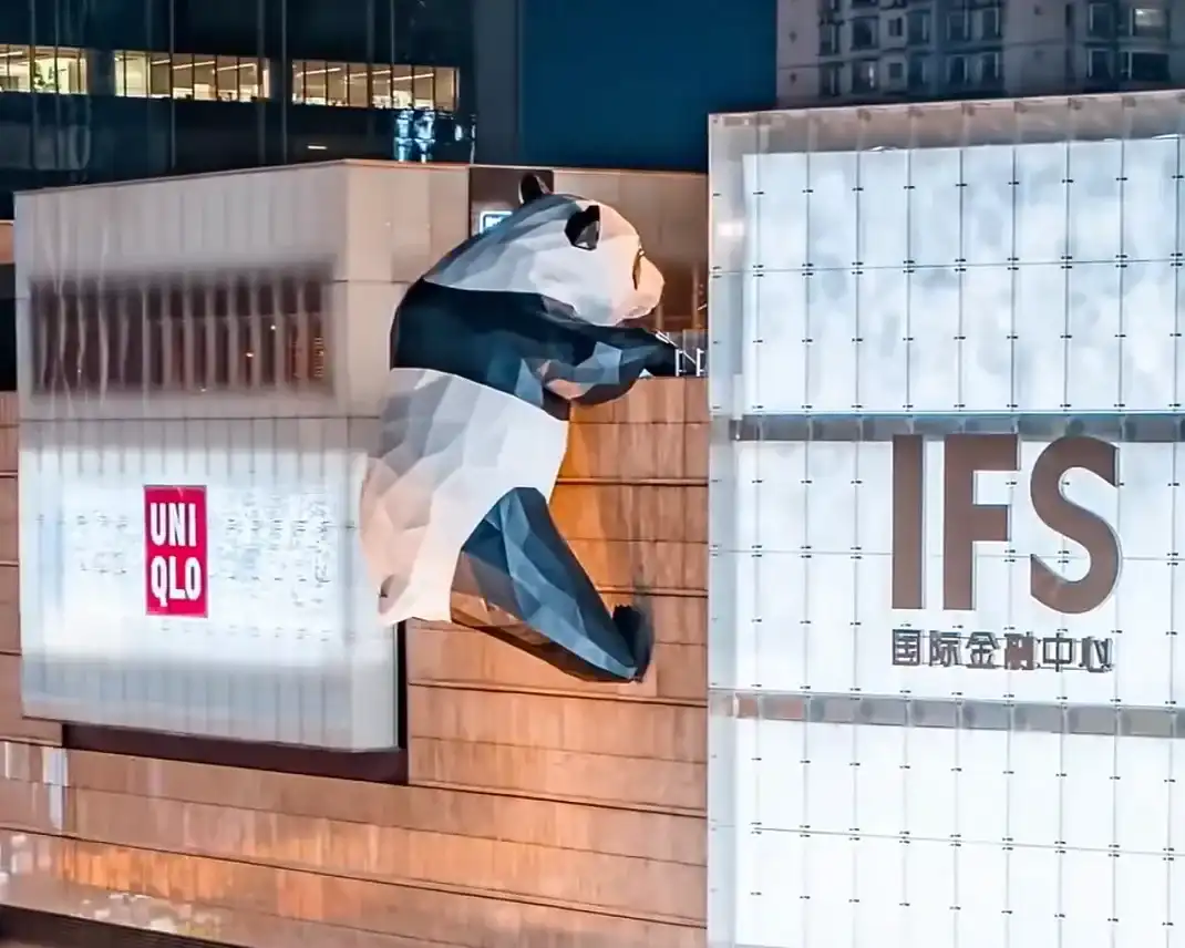 Giant panda sculpture climbing the façade of Chengdu IFS