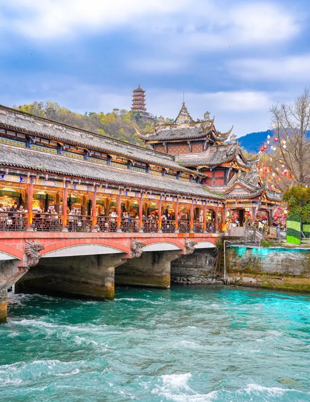 Fast water beside traditional buildings at Dujiangyan