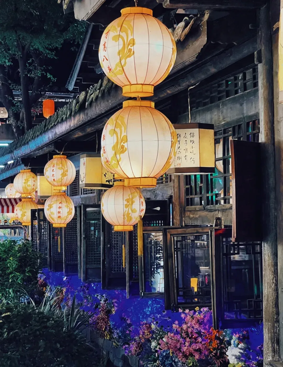 Rows of lanterns along a narrow lane in Jinli