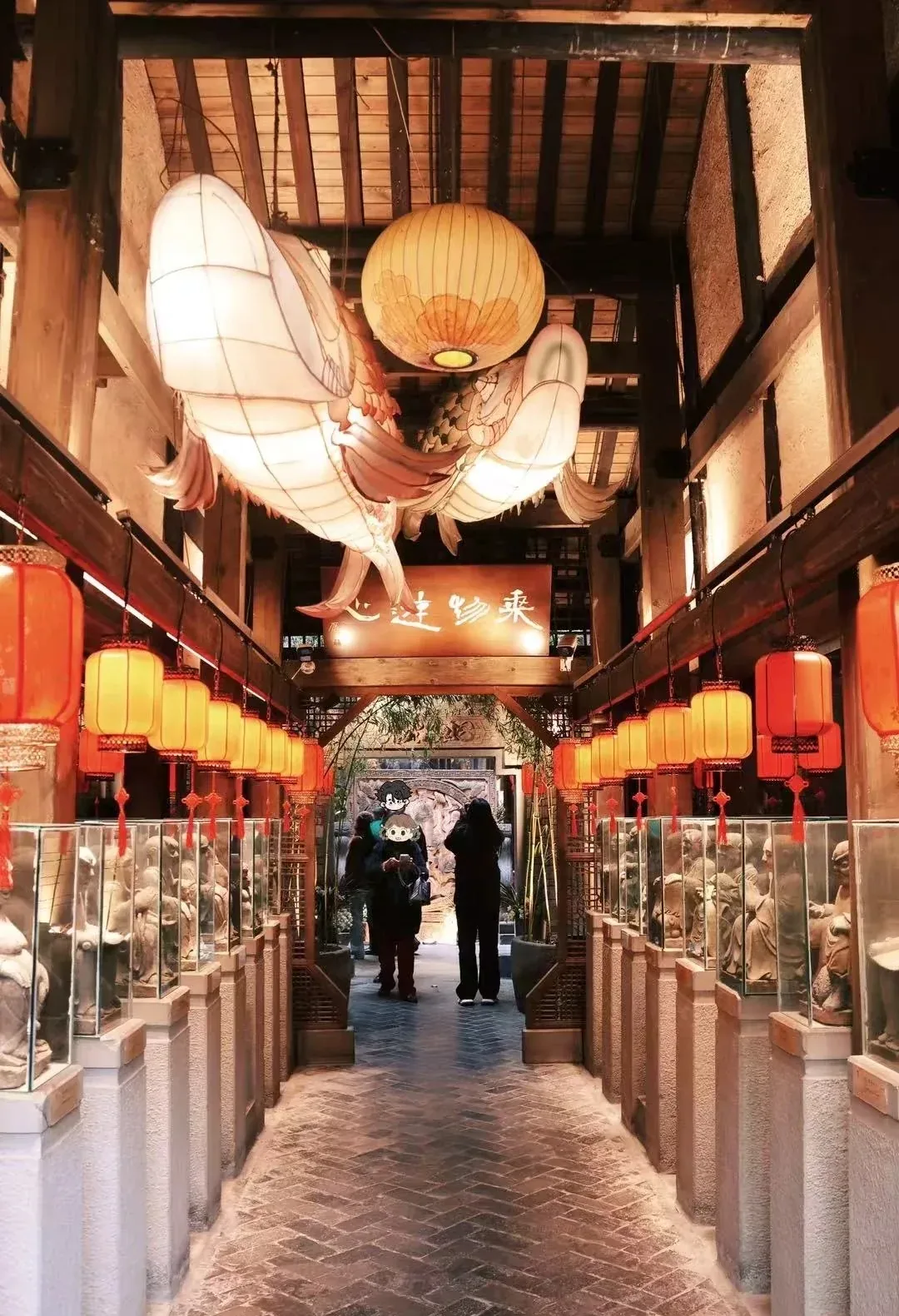 Covered passage and lanterns inside a Kuanzhai courtyard