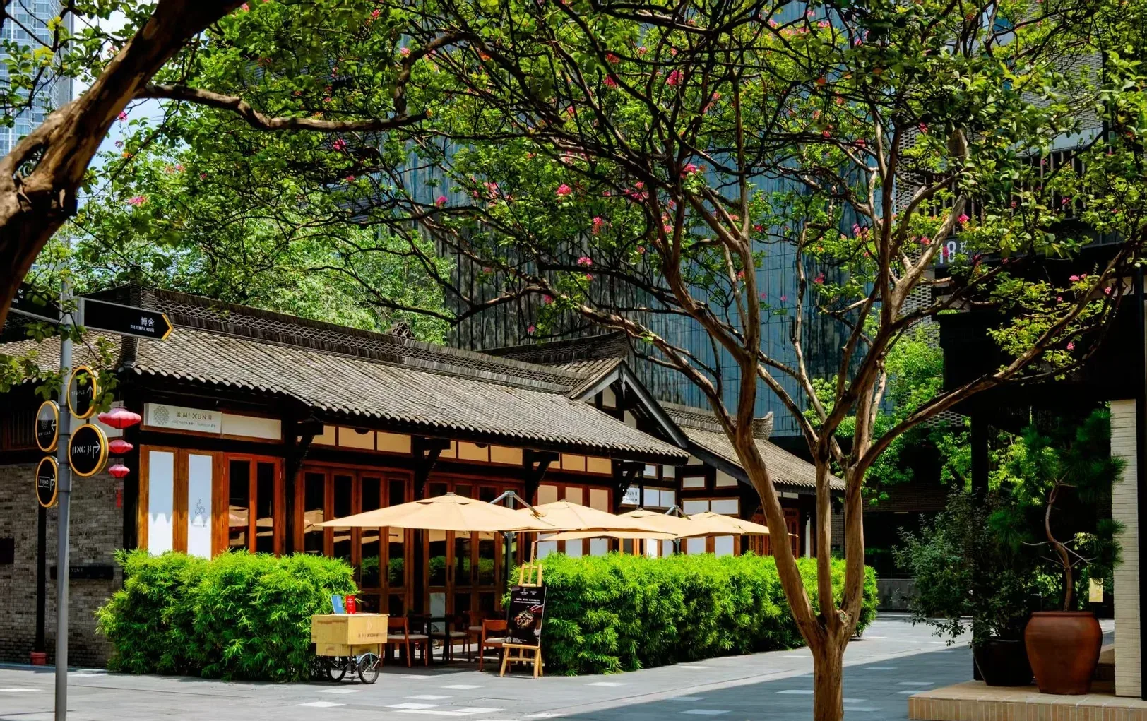 Tree-shaded low-rise courtyard buildings at Taikoo Li