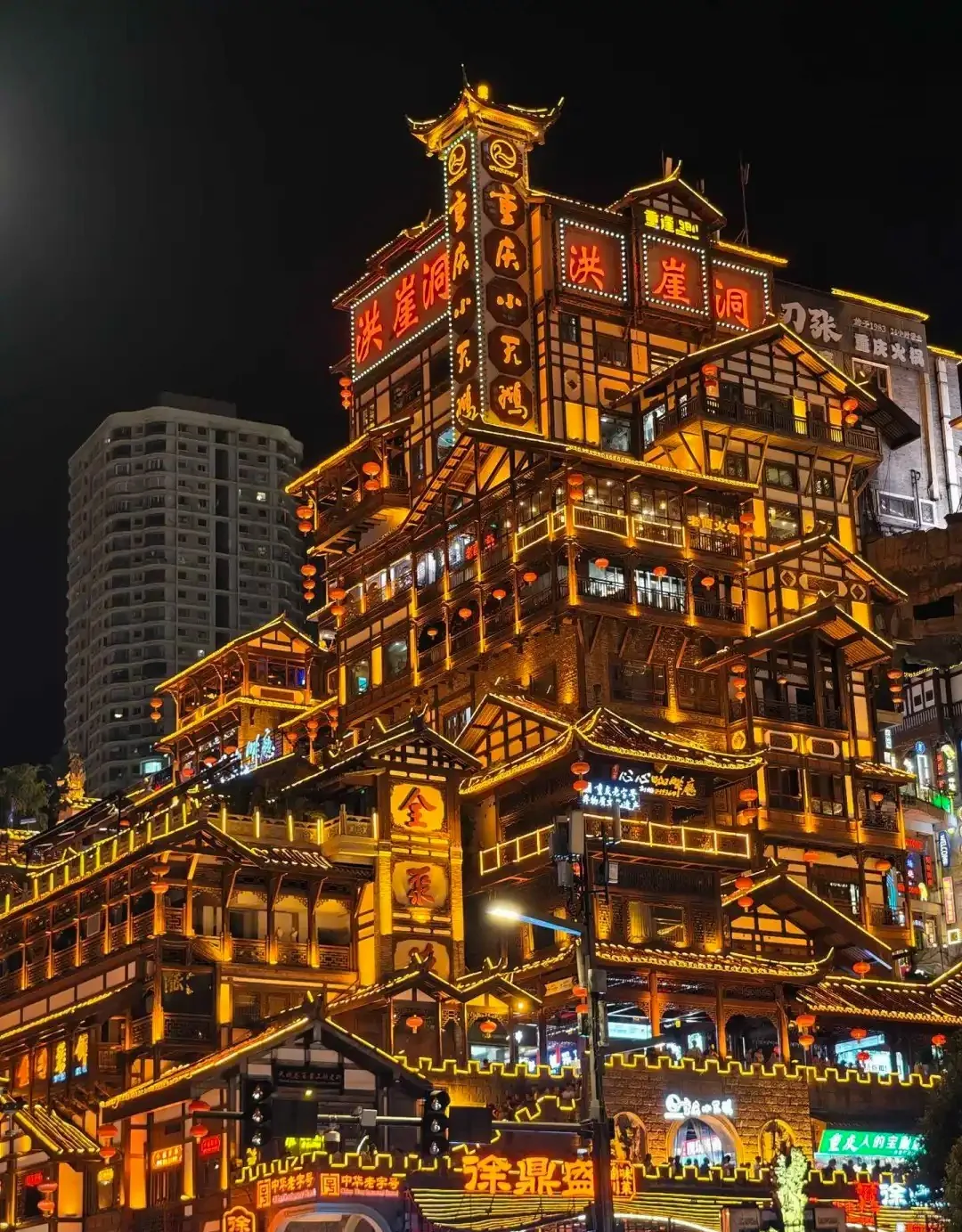 Tiered roofs and cliffside galleries at Hongya Cave
