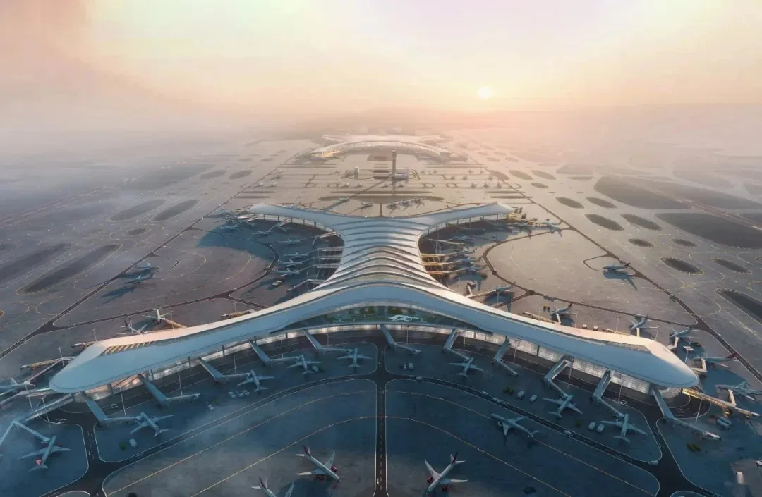 Aerial view of Chongqing Jiangbei International Airport T3, its concourses, apron, and runways at sunset