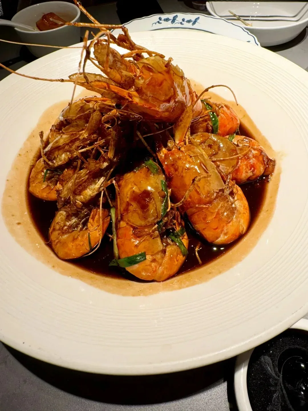 Shell-on quick-fried prawns in a sweet-savoury glaze