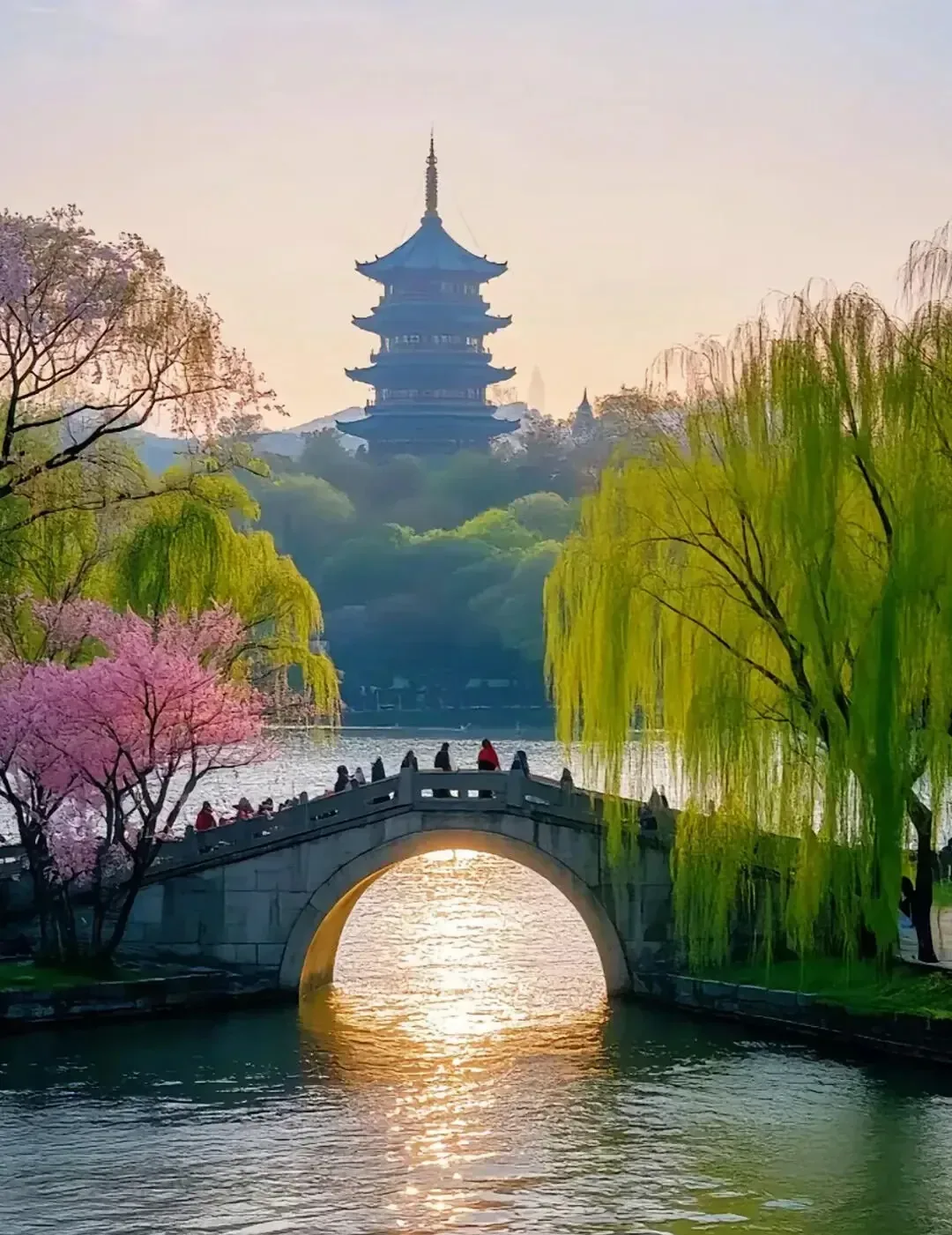 A spring bridge, willow trees, and Leifeng Pagoda
