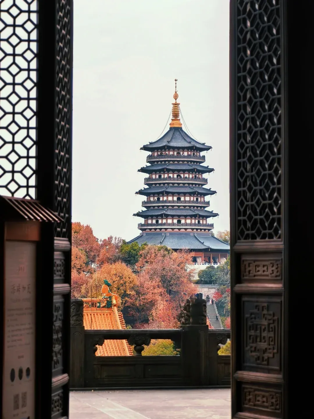 Leifeng Pagoda framed by a Chinese-style window