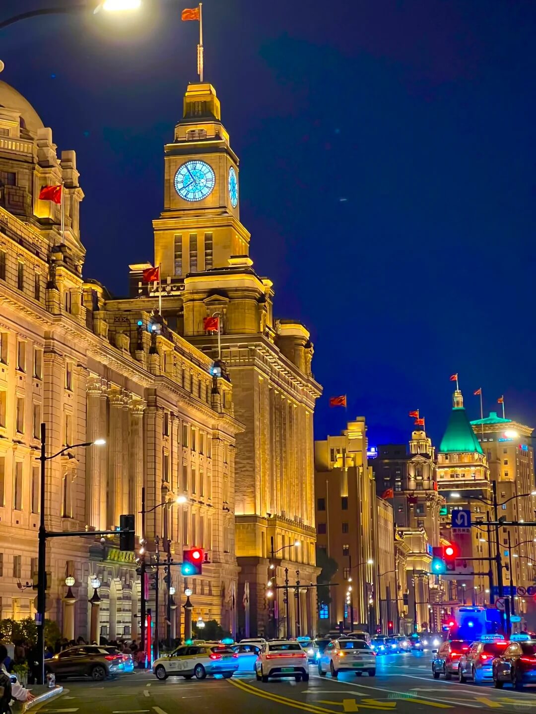 Historic Bund buildings and the Customs House clock tower at night