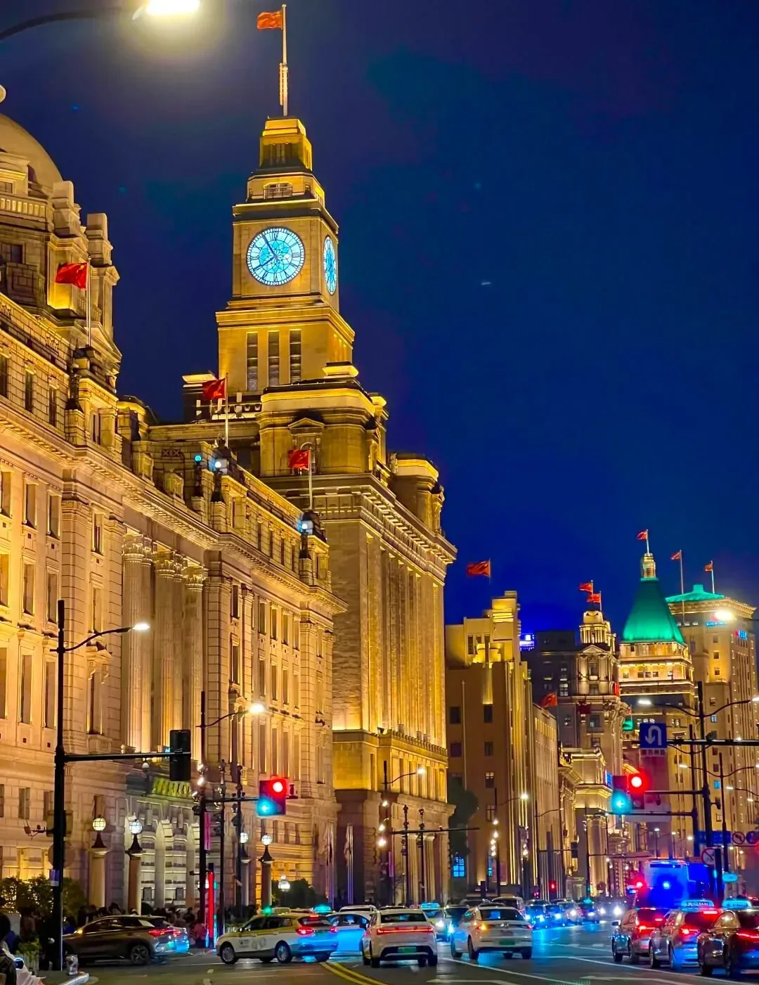 Historic Bund buildings and the Customs House clock tower at night