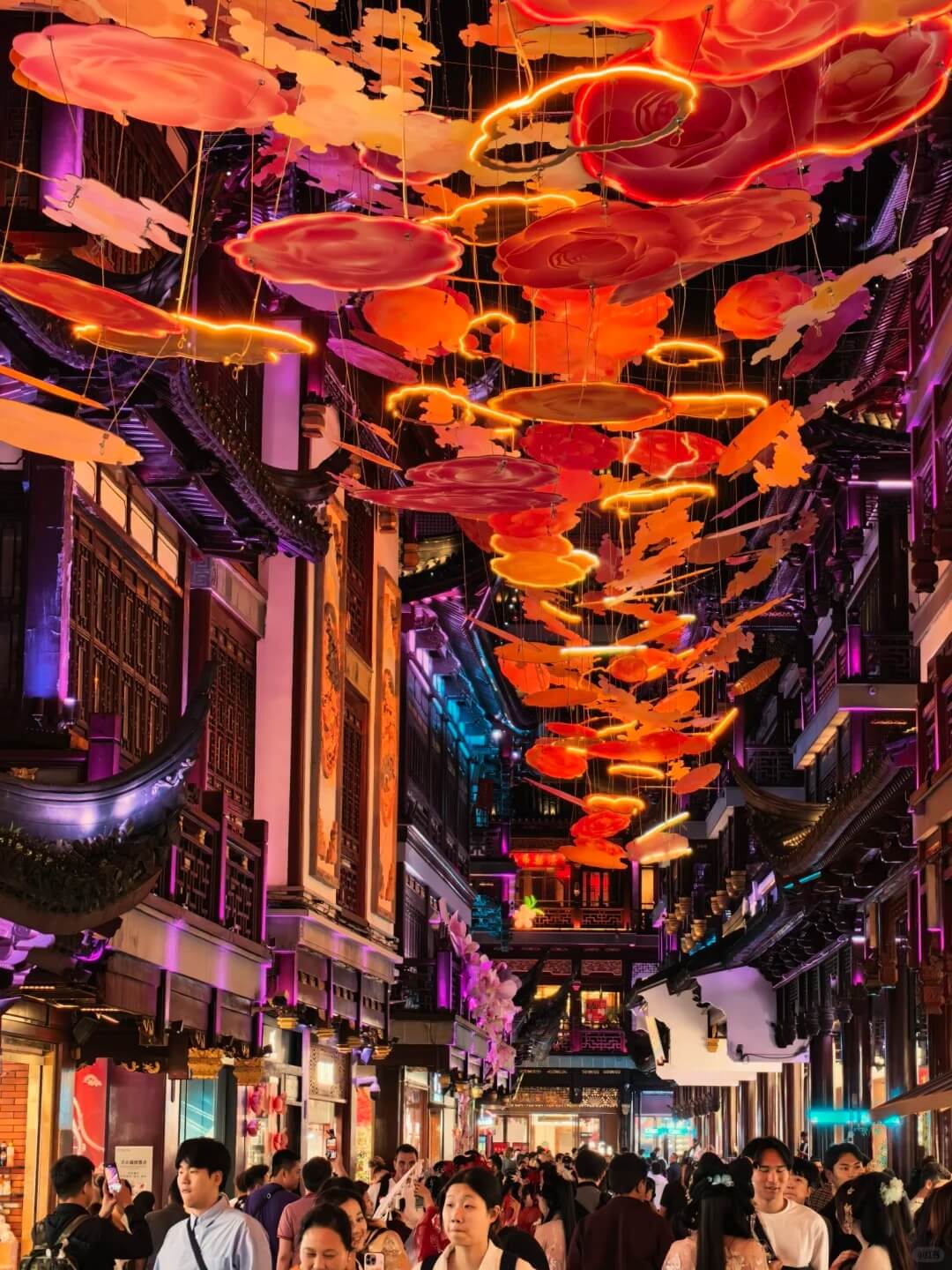 Seasonal lantern installation above a bazaar lane