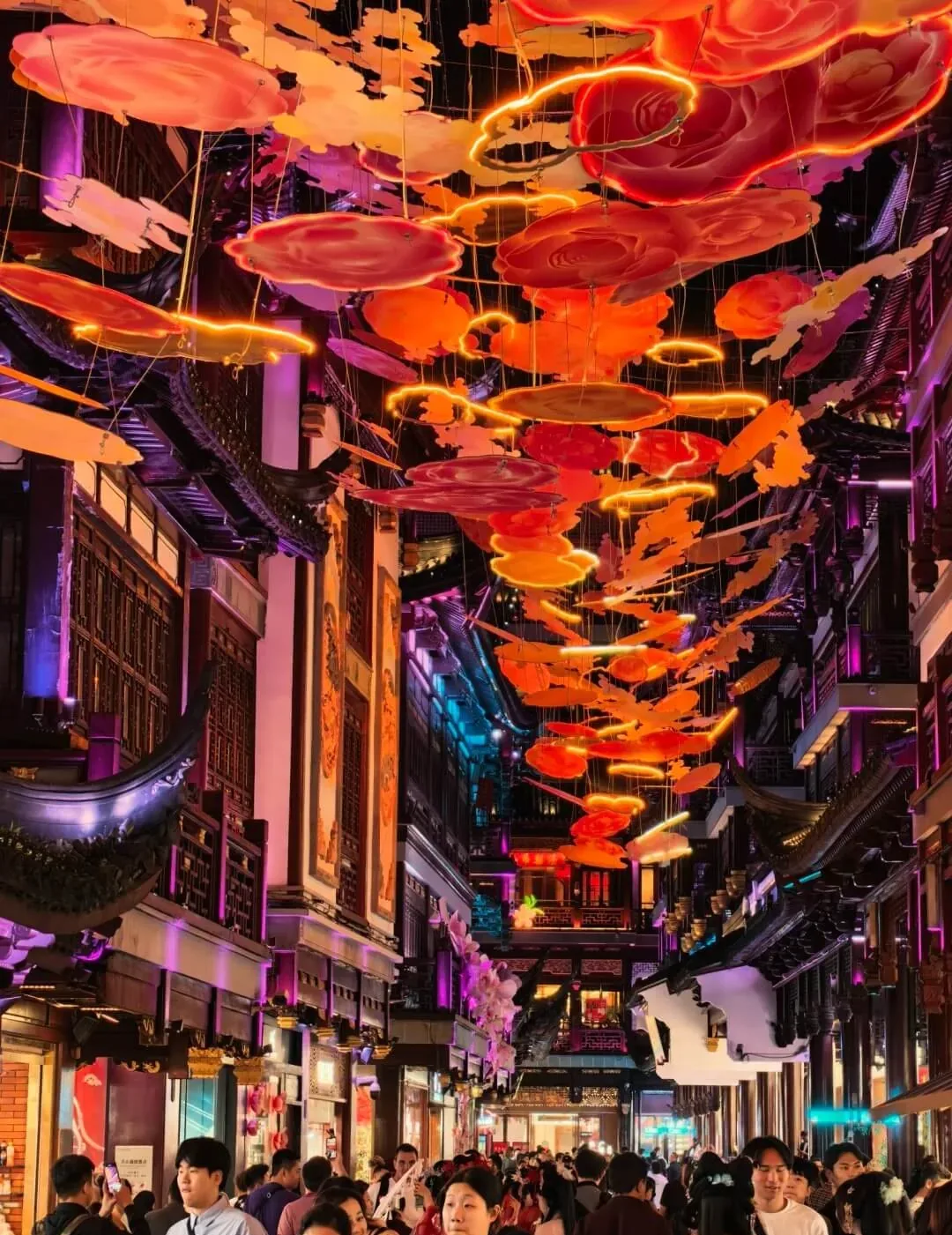 Seasonal lantern installation above a bazaar lane