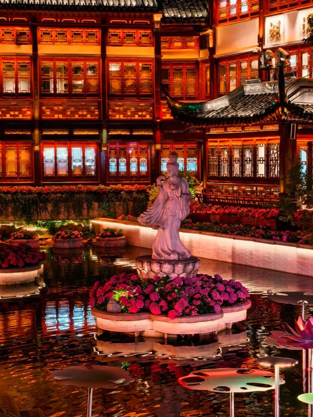 Water, sculpture and illuminated bazaar buildings