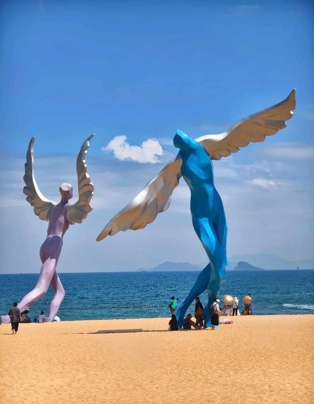 Winged Man sculptures at the eastern end of the beach