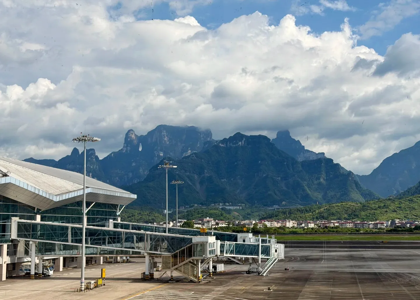 Cloud-covered Tianmen Mountain behind the apron at Zhangjiajie Hehua International Airport