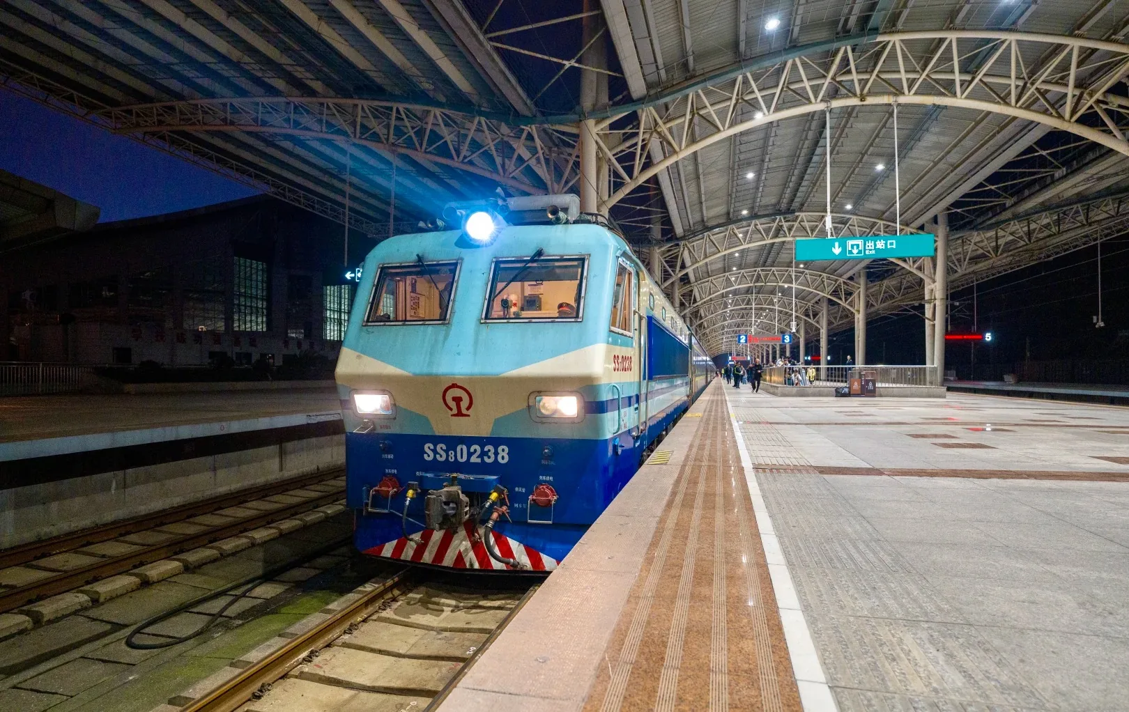 Conventional train at the platform of Zhangjiajie Railway Station at night